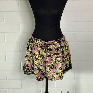 Black, yellow, and pink Lululemon athletic shorts, size 16